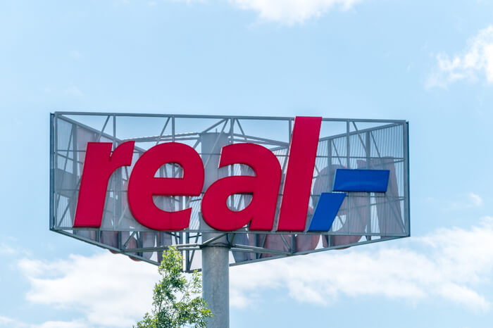 Logo des Unternehmens Real
