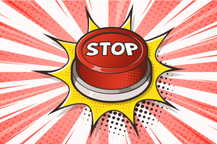Bitte aufhören! – Stop-Schriftzug auf einem Button