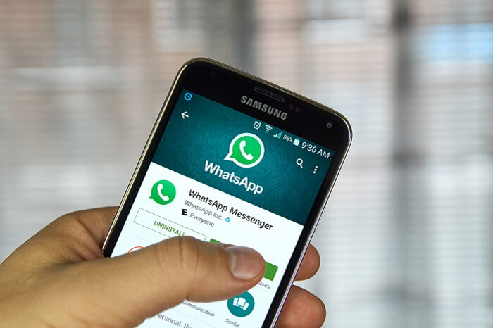  Whatsapp mobile application on screen of Samsung S5 in hand.