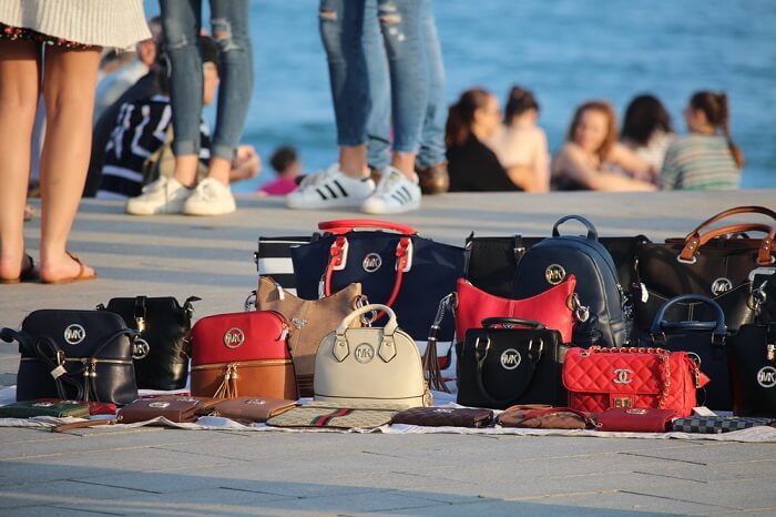 Copies of popular brands of women bags sold on the Barceloneta beach